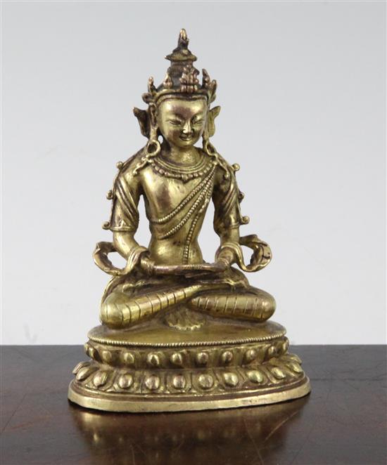 A small Tibetan gilt bronze seated figure of Amitayus, 18th/19th century, height 11cm